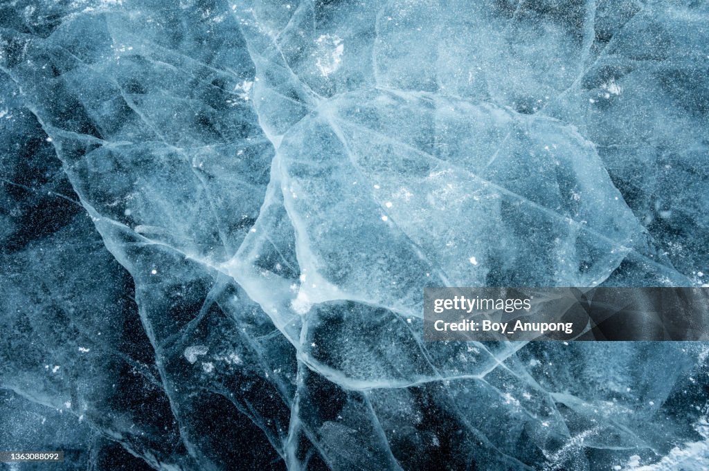 Beautiful cracks surface of the frozen lake of Baikal lake in winter season.
