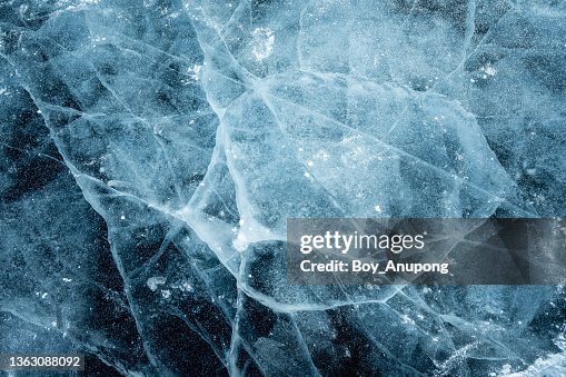Beautiful cracks surface of the frozen lake of Baikal lake in winter season. Beautiful cracks surface of the frozen lake of Baikal lake in winter season.