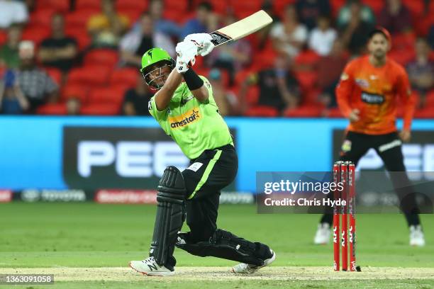 Oliver Davies of the Thunder bats during the Men's Big Bash League match between the Perth Scorchers and the Sydney Thunder at Metricon Stadium, on...