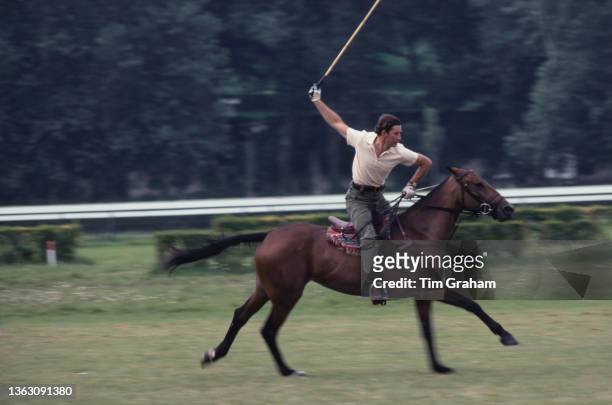 Prince Charles, the Prince of Wales practising before a polo match in Deauville, France, 19th August 1978.