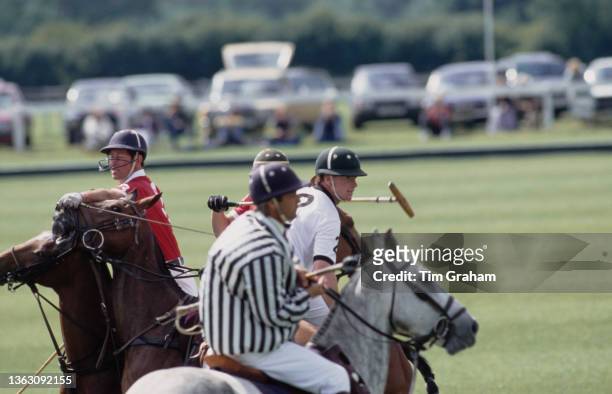 Prince Charles, the Prince of Wales playing polo with James Hewitt and others at the Royal County of Berkshire Polo Club, UK, July 1991.