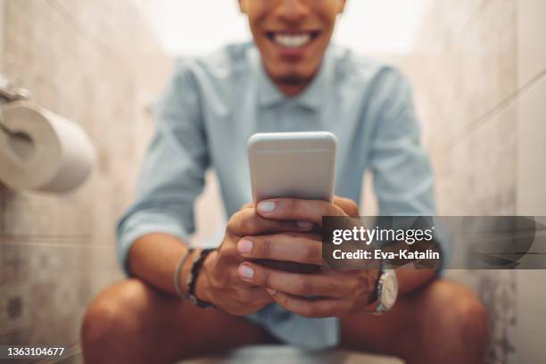 young man at home - men taking a dump stock pictures, royalty-free photos & images