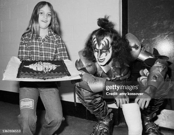 "The Demon" Gene Simmons of KISS shows his softer side as he greets a young fan backstage at Alex Cooley's Electric Ballroom in Atlanta, Georgia....