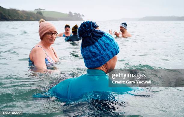 group of open water swimmers - cold temperature stock-fotos und bilder