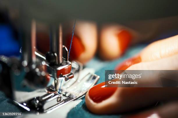 sewing clothes on sewing machine - atelier fashion stock pictures, royalty-free photos & images