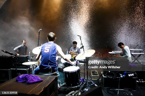 View from behind the drums at the back of the stage as American indie guitar band Vampire Weekend perform at Latitude Festival in 2010