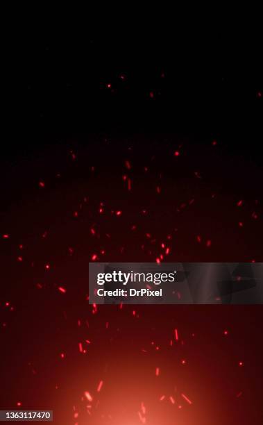 flying red hot fire sparks - red glitter stock-fotos und bilder