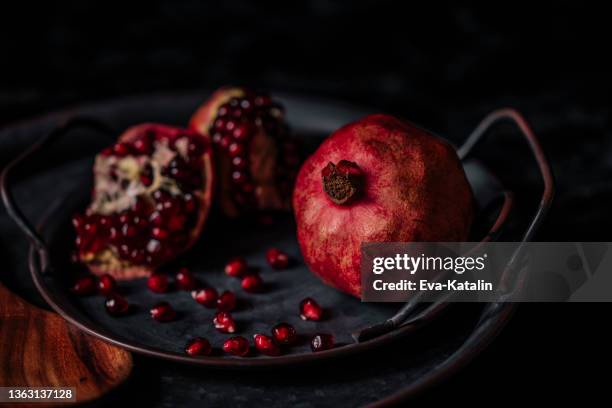 still life with pomegranates - pomegranate stock pictures, royalty-free photos & images