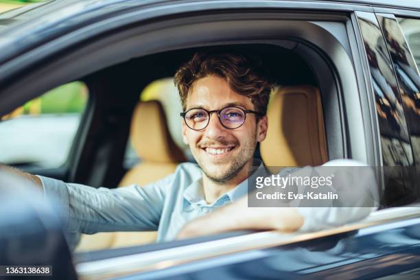 man driving his car - taxi driver stock pictures, royalty-free photos & images