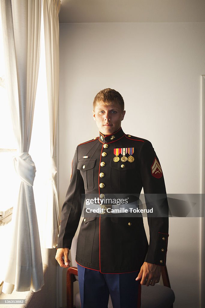 Portrait of a young Marine by the window