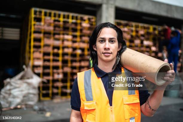 portrait of a non-binary person at a warehouse - non binary stereotypes stock pictures, royalty-free photos & images