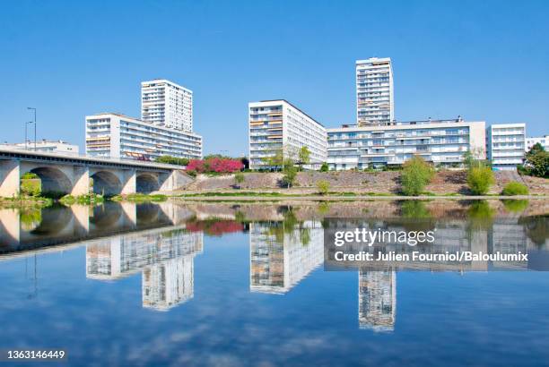 reflection of apartment buildings in the cher, in tours, france - indre et loire stock pictures, royalty-free photos & images