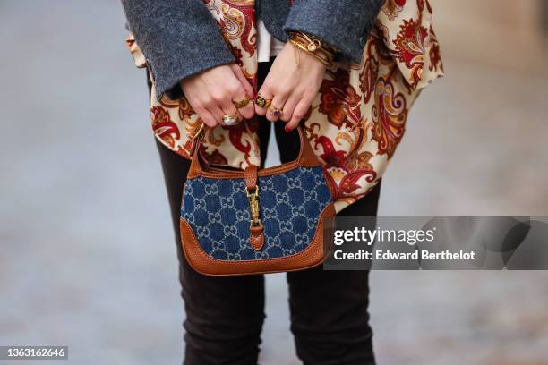 Alba Garavito Torre wears a blue vintage wool blazer jacket, a beige and burgundy floral print scarf over the blazer jacket, black skinny pants from...