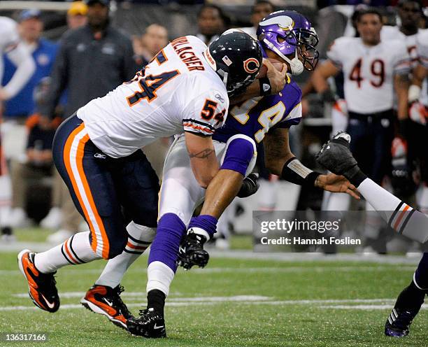 Brian Urlacher of the Chicago Bears brings down Joe Webb of the Minnesota Vikings during the first quarter on January 1, 2012 at Mall of America...