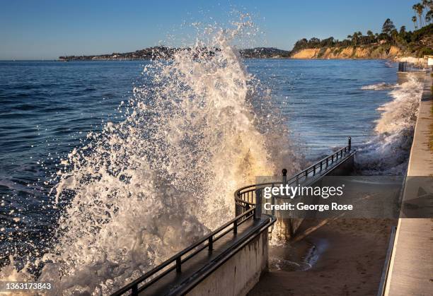 An unusually high "King Tide" of nearly 7 feet pushes waves against the seawall at Butterfly Beach on January 2 in Santa Barbara, California. An...