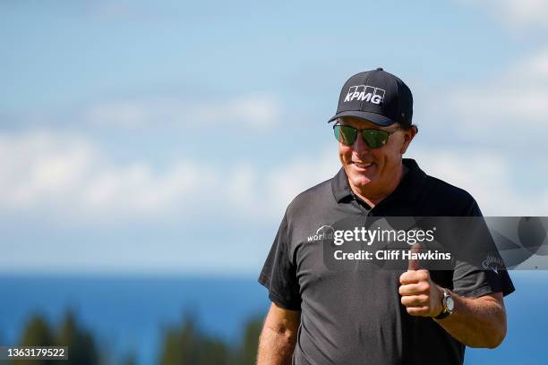 Phil Mickelson of the United States gives a thumbs up as he walks to the first tee during the first round of the Sentry Tournament of Champions at...