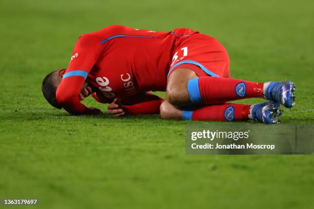 Faouzi Ghoulam of SSC Napoli crashes to the ground after clashing with an opponent during the Serie A match between Juventus and SSC Napoli at...