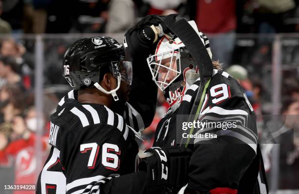 Mackenzie Blackwood of the New Jersey Devils is congratulated by P.K. Subban after the game against the Columbus Blue Jackets at Prudential Center on...