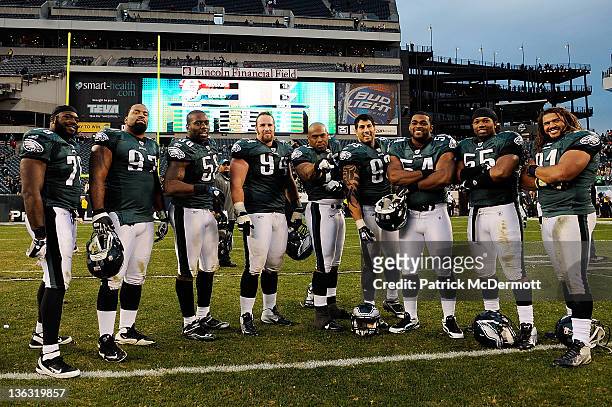 Members of the Philadelphia Eagles defense stand for a photo after defeating the Washington Redskins 34-10 at Lincoln Financial Field on January 1,...