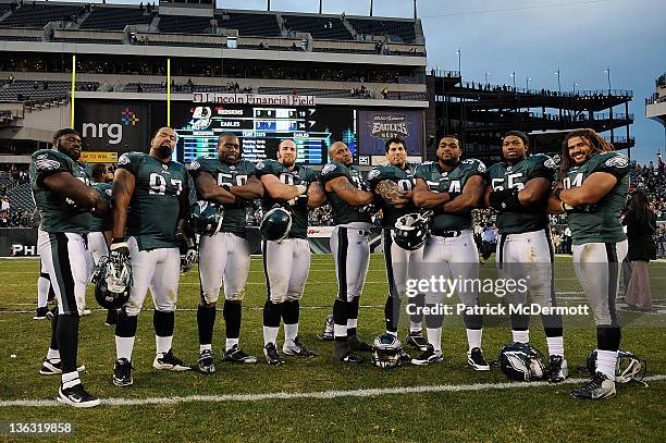 Members of the Philadelphia Eagles defense stand for a photo after defeating the Washington Redskins 34-10 at Lincoln Financial Field on January 1,...