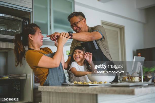 we have so much fun when baking - asian mom cooking stock pictures, royalty-free photos & images