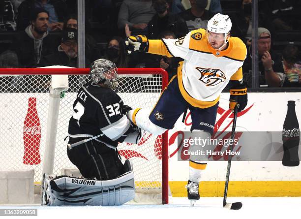 Jonathan Quick of the Los Angeles Kings hangs on to the leg of Ryan Johansen of the Nashville Predators during the second period at Staples Center on...