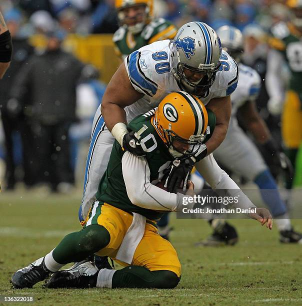 Ndamukong Suh of the Detroit Lions sacks Matt Flynn of the Green Bay Packers at Lambeau Field on January 1, 2012 in Green Bay, Wisconsin. The Packers...