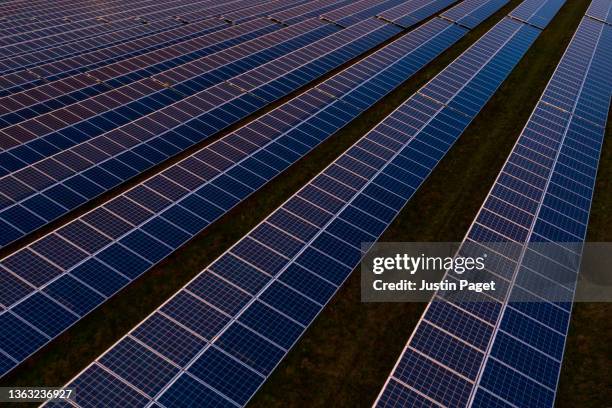 drone view over a field of solar panels - drone point of view photos stock pictures, royalty-free photos & images