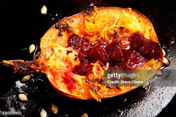 roasted organic squash with pickled red beets - spaghetti squash stock pictures, royalty-free photos & images