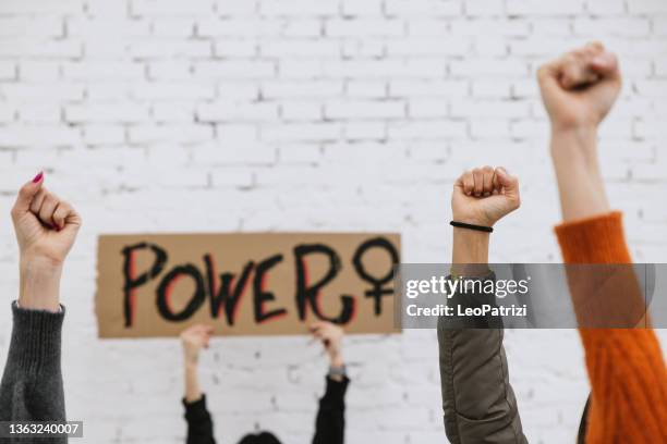 activists protesting for equal women's rights - womens history month stock pictures, royalty-free photos & images