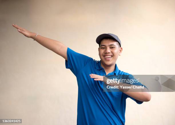 teenage boy dancing - teenage boy in cap posing stock pictures, royalty-free photos & images