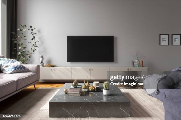 scandinavian style modern living room - tv on wall stockfoto's en -beelden