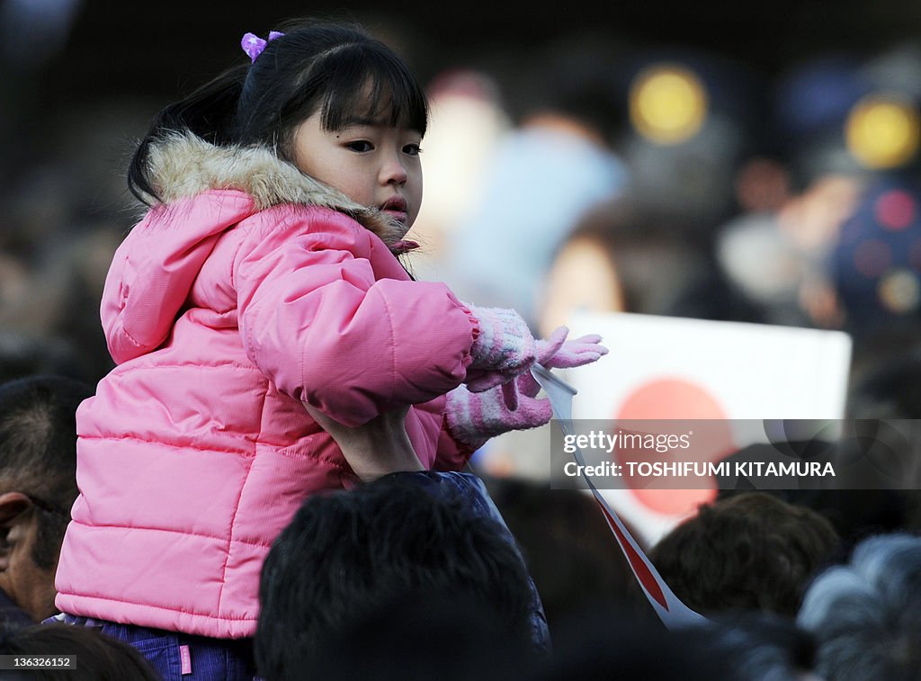 A girl holds the national flag on the sh