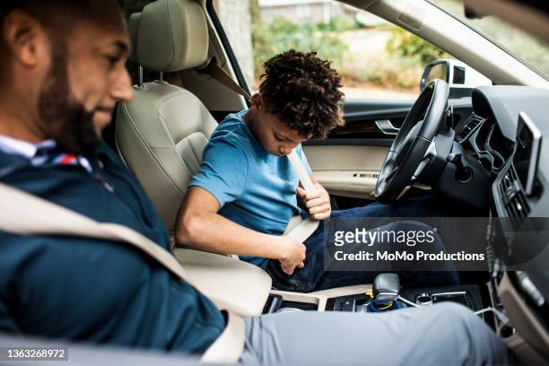 father teaching teenage son to drive in his first car - choicepix stock pictures, royalty-free photos & images