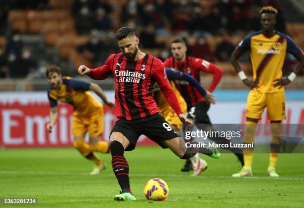 Olivier Giroud of AC Milan scores from the penalty spot to make it 1-0 during the Serie A match between AC Milan and AS Roma at Stadio Giuseppe...