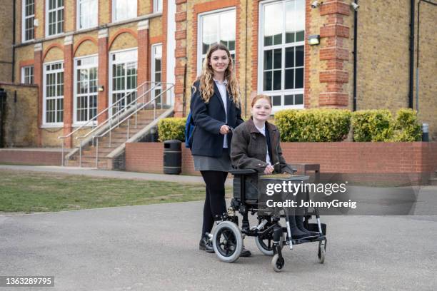 campus portrait of secondary schoolgirls on the way to class - female high school student stock pictures, royalty-free photos & images