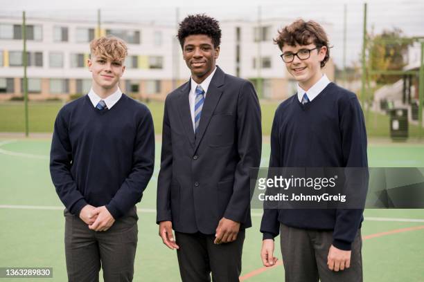 outdoor portrait of teenage schoolboys in uniforms - school tie stockfoto's en -beelden