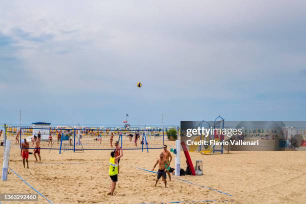 beach volleyball in bibione (veneto, italy) - bibione stock pictures, royalty-free photos & images