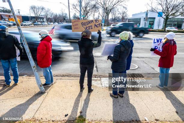 Coalition of non-partisan people led by the League of Women Voters rally on January 6 in Huntington, New York, calling for protection of the voting...