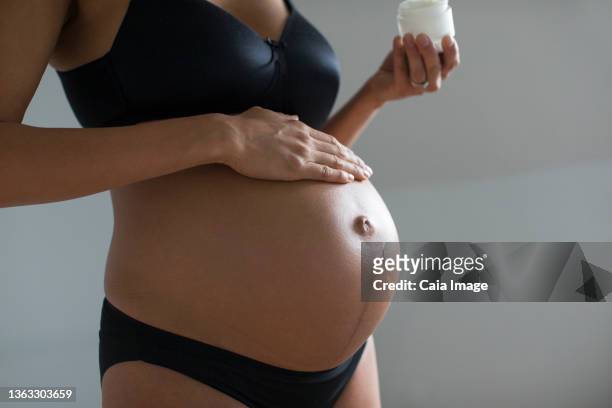 Female hanging belly with stretch marks on skin closeup. Overweight woman  flaunt figure Stock Photo by burmistrovaiuliia