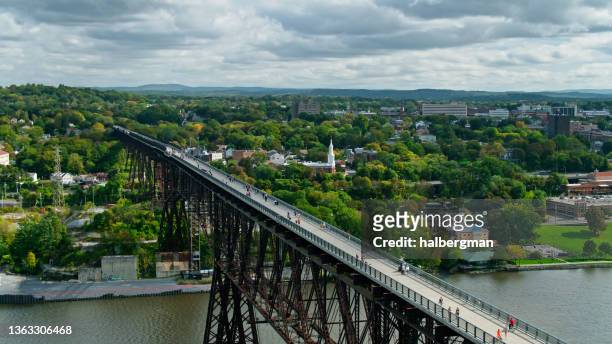tourists on walkway over the hudson in poughkeepsie, ny - elevated walkway stock pictures, royalty-free photos & images