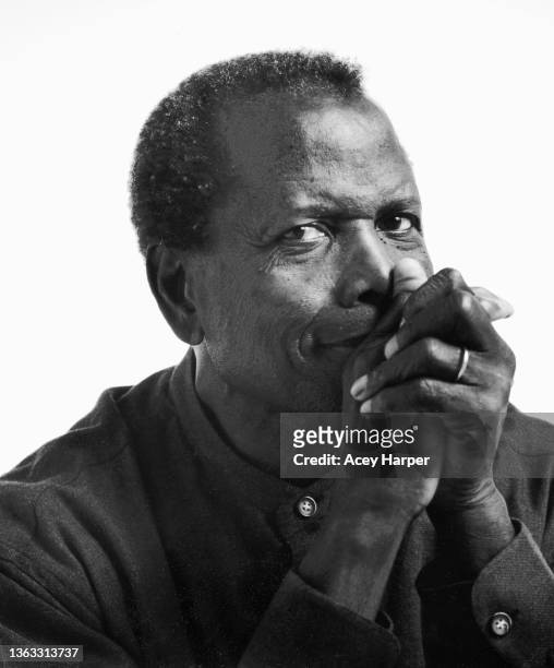 Portrait of American actor, director, and activist Sidney Poitier 1927 - 2022) as he poses in front of a white background, Los Angeles, California,...
