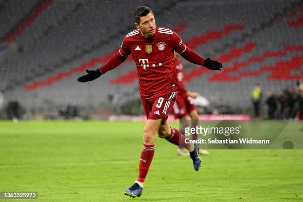Robert Lewandowski of Muenchen celebrates after scoring his teams first goal during the Bundesliga match between FC Bayern München and Borussia...