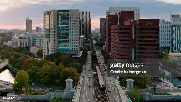 train crossing longfellow bridge entering tunnel in cambridge, ma - aerial - cambridge aerial stock pictures, royalty-free photos & images