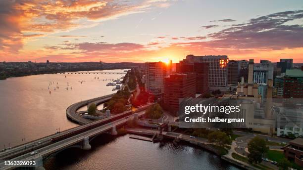 cambridge, massachusetts at sunset as train approaches longfellow bridge - aerial - harvard aerial stock pictures, royalty-free photos & images