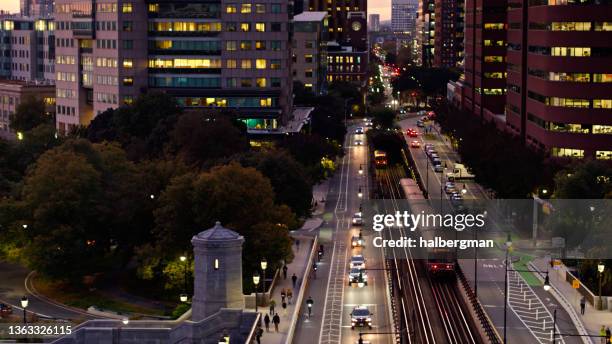 red line trains passing each other in cambridge, ma - aerial - cambridge street stock pictures, royalty-free photos & images