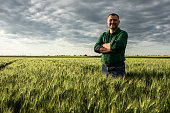 Portrait of middle age farmer in wheat field.