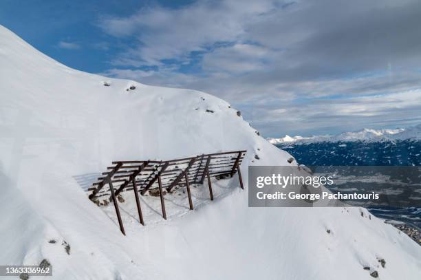 construction to prevent avalanches on a mountain with snow - north tirol stock pictures, royalty-free photos & images