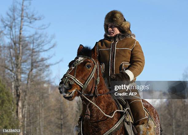 Picture released on March 6, 2010 shows Russian Prime Minister Vladimir Putin taking a horseback ride in the Karatash area, near the town of Abakan,...