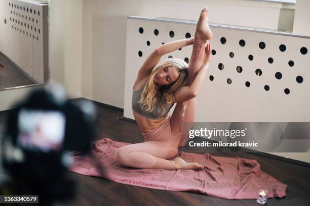 blonde girl doing yoga. - dumb blonde stock pictures, royalty-free photos & images